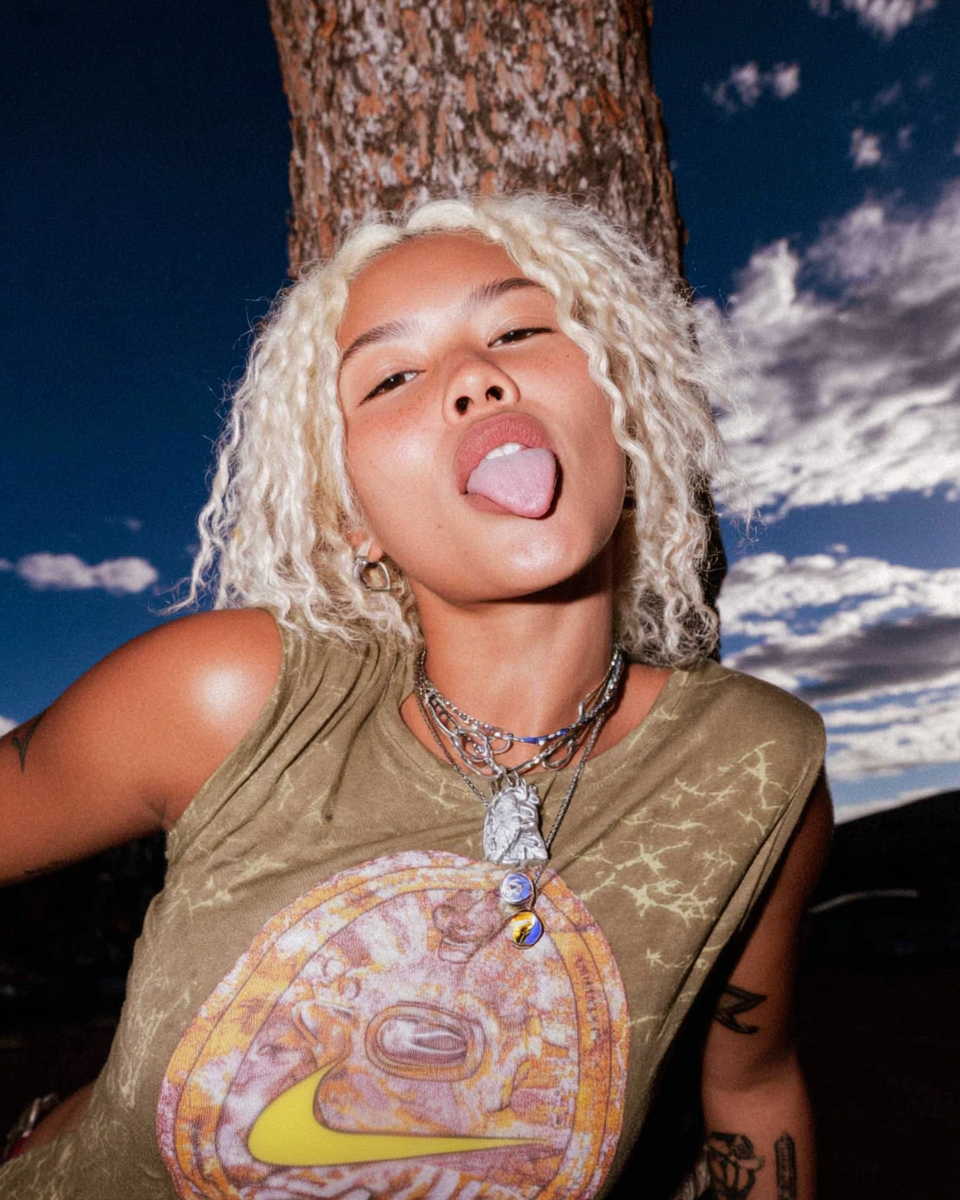 potatoad.studio_a_blonde_woman_wearing_a_green_t-shirt_with_a_5f828f34-c281-483a-8287-61605c161014_1